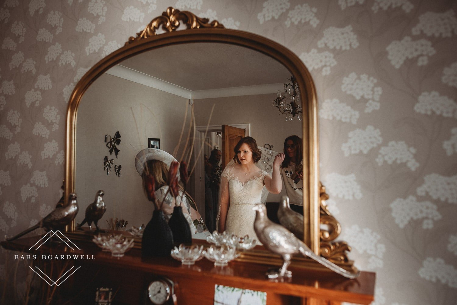 bride looking in the mirror checking her look
