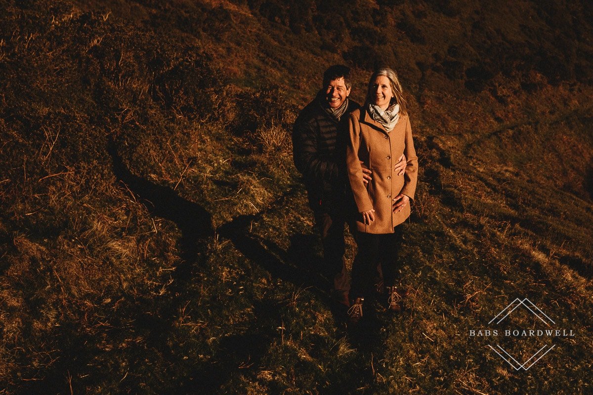 couple smiling holding on to each other