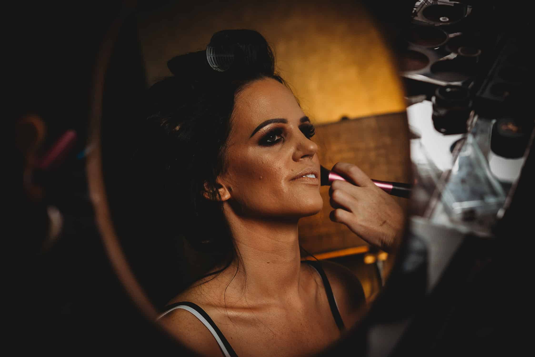 The Quay Hotel Wedding Photographer in Conwy North Wales portrait of bride having make-up applied