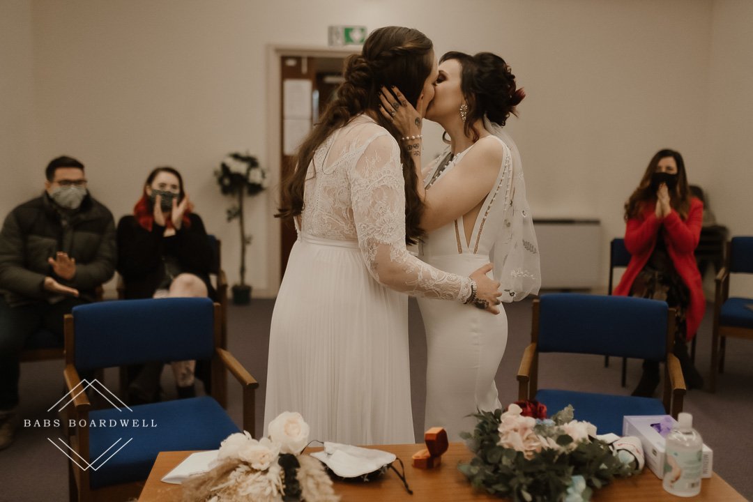 lesbian couple sharing their first kiss as wife and wife at Dolgellau Registry Office