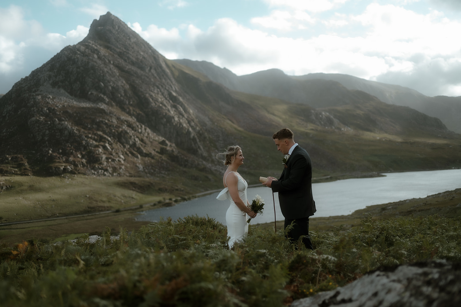 couple on their elopement day in Wales overlooking Tryfan while exchanging their wedding vows