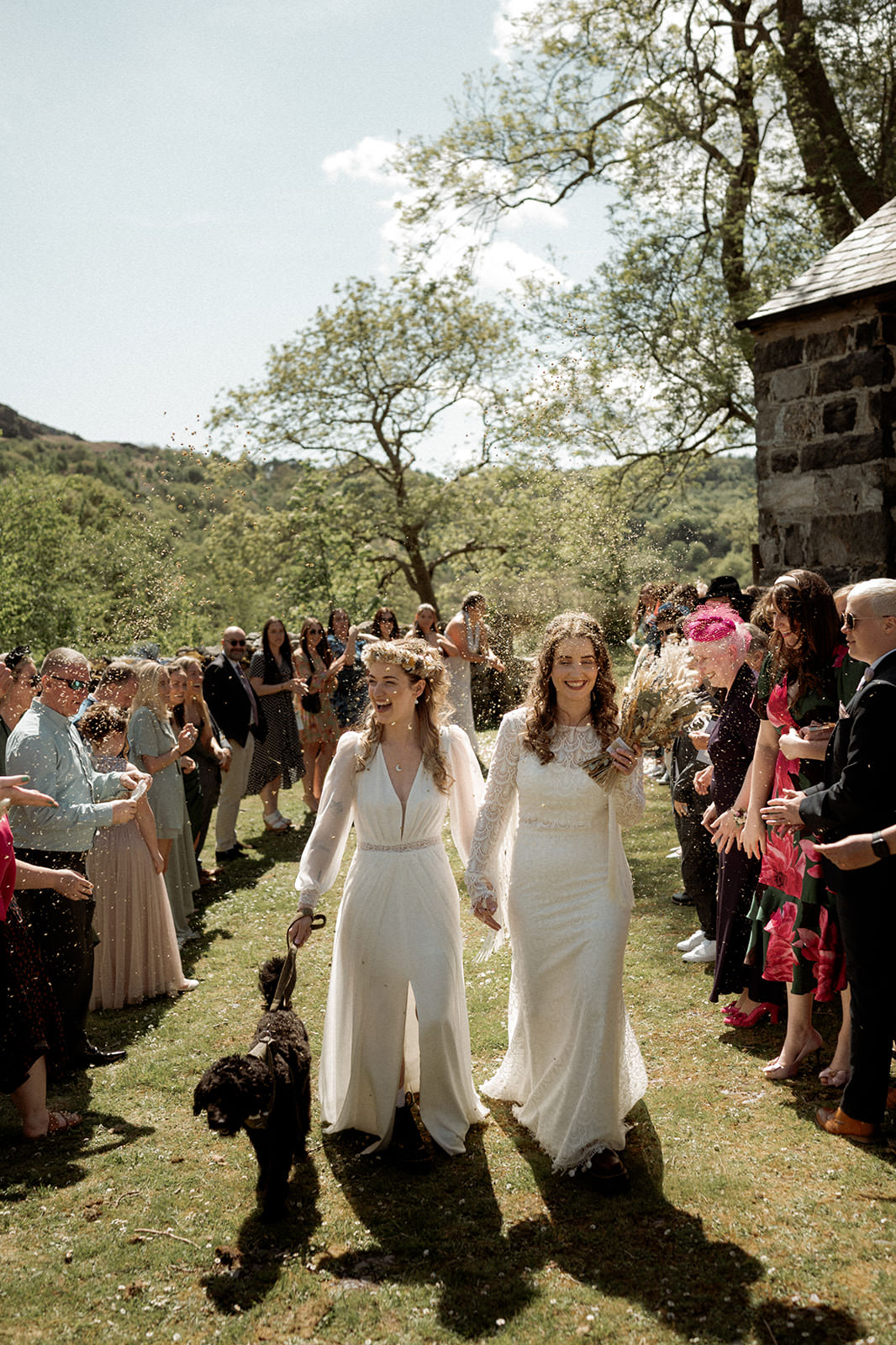 North Wales Wedding Photographer | 2 brides getting married at Llyn Gwynant Barns with confetti