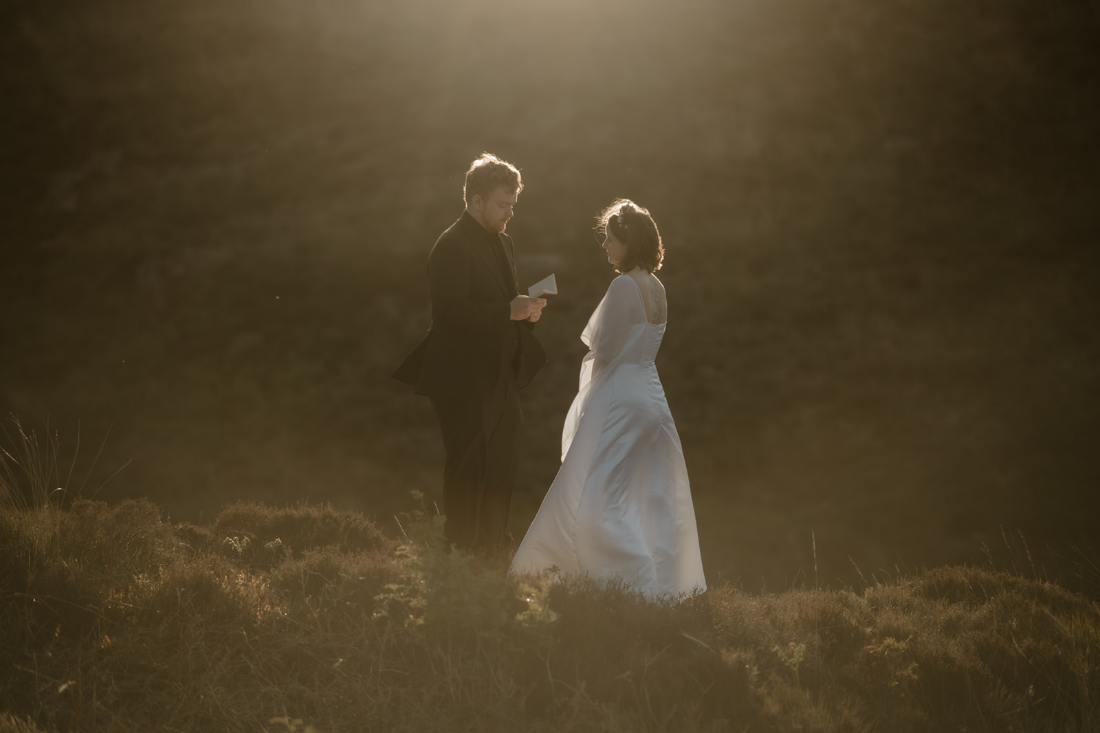 couple exchanging private vows in the mountains of Eryri at sunset