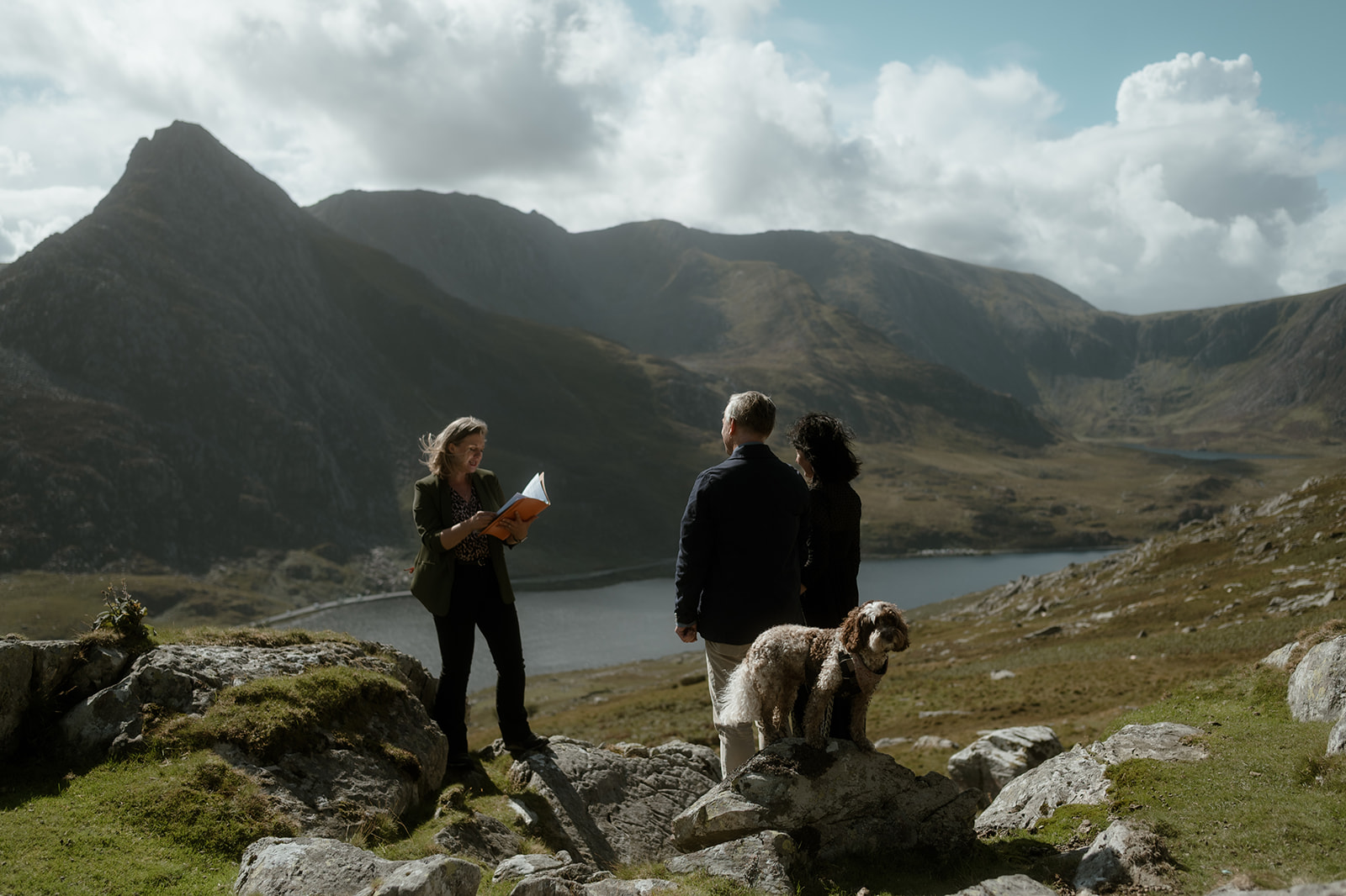 a couple and their dog overlooking Tryfan during their handfasting commitment ceremony with Kate Rostance Celebrant