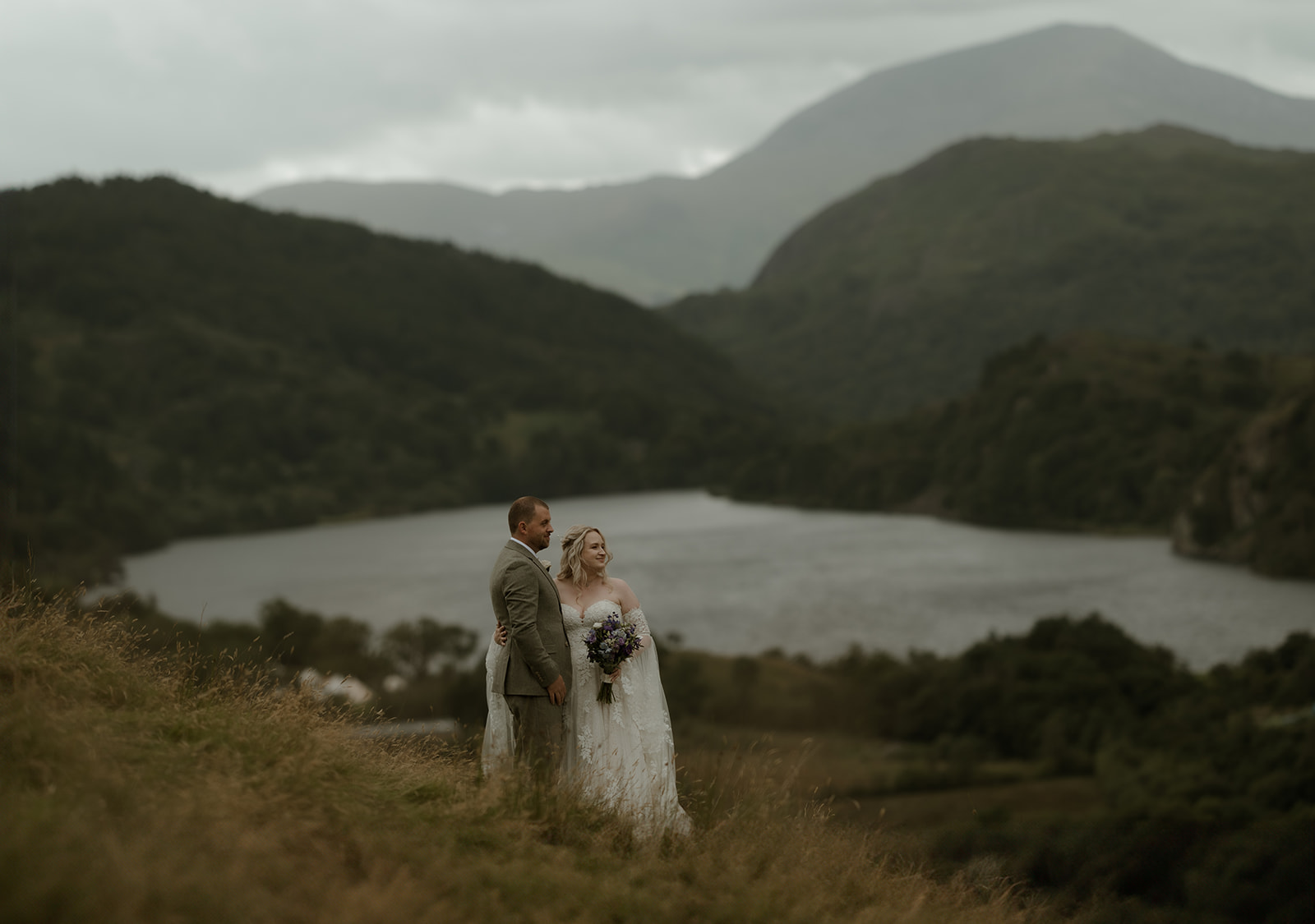 Couple exchanging quiet vows overlooking Llyn Gwynant during their small, nature-led wedding.