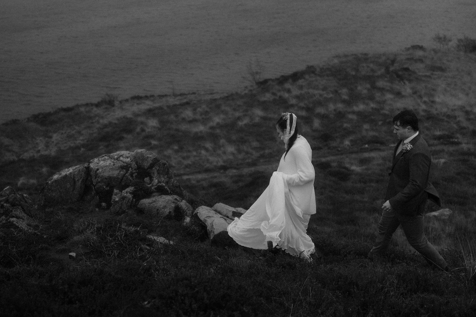 couple walking in the rain on their elopement day in North Wales